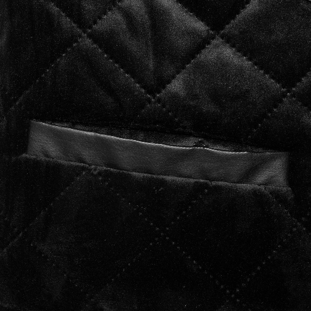 Close-up of quilted black velvet fabric with a discreet pocket detail for men's Gothic waistcoat.