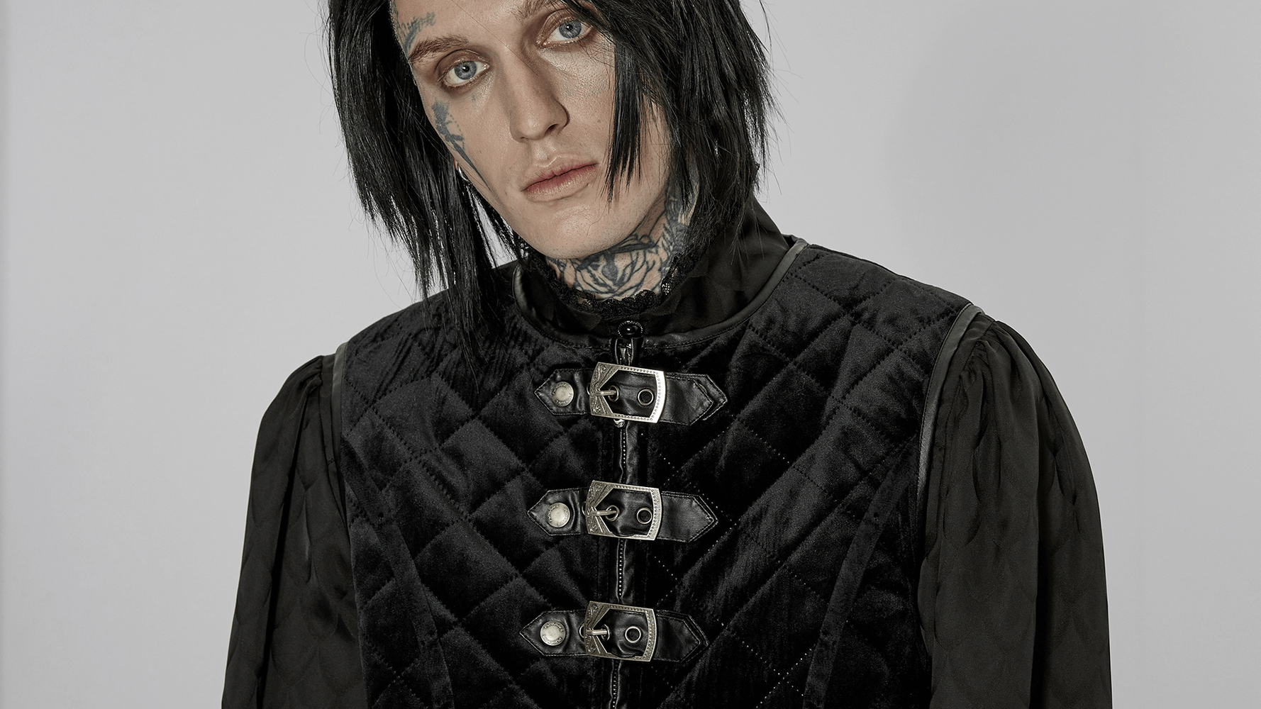 Gothic quilted men's waistcoat in black with metal clasp closure, perfect for a stylish layered look.