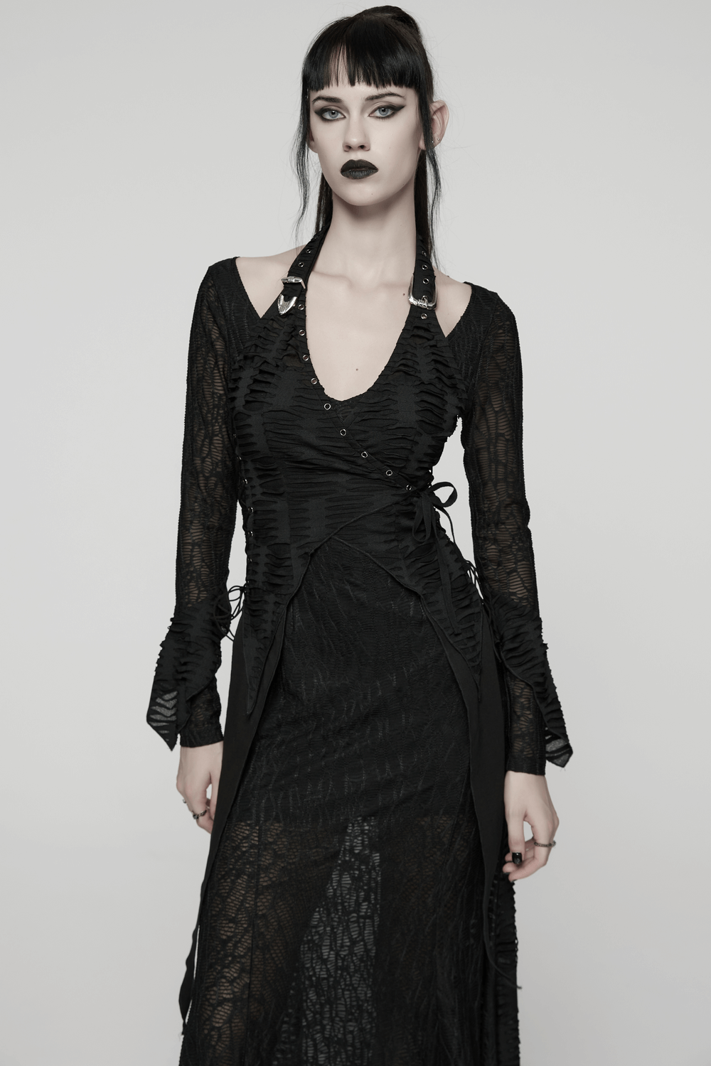 Gothic Ragged Knit Mesh Dress with Fish-tail Hem worn by a model, showcasing a halterneck and unique waist straps.