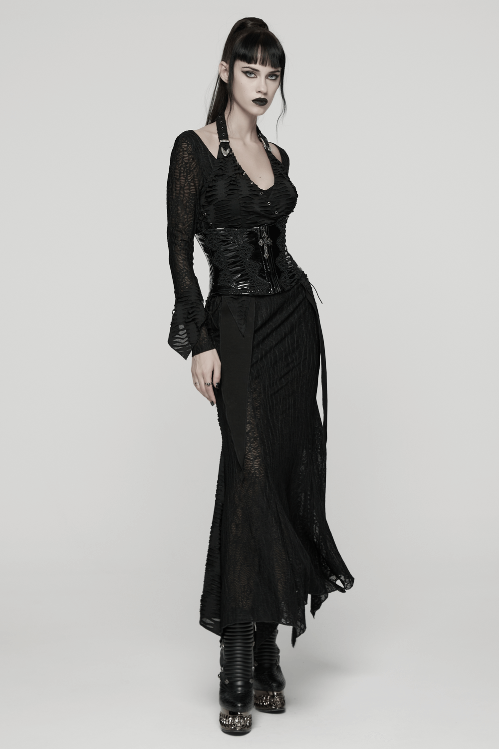 Gothic Ragged Knit Mesh Dress with Fish-tail Hem worn by model, showcasing its unique halterneck and striking silhouette.