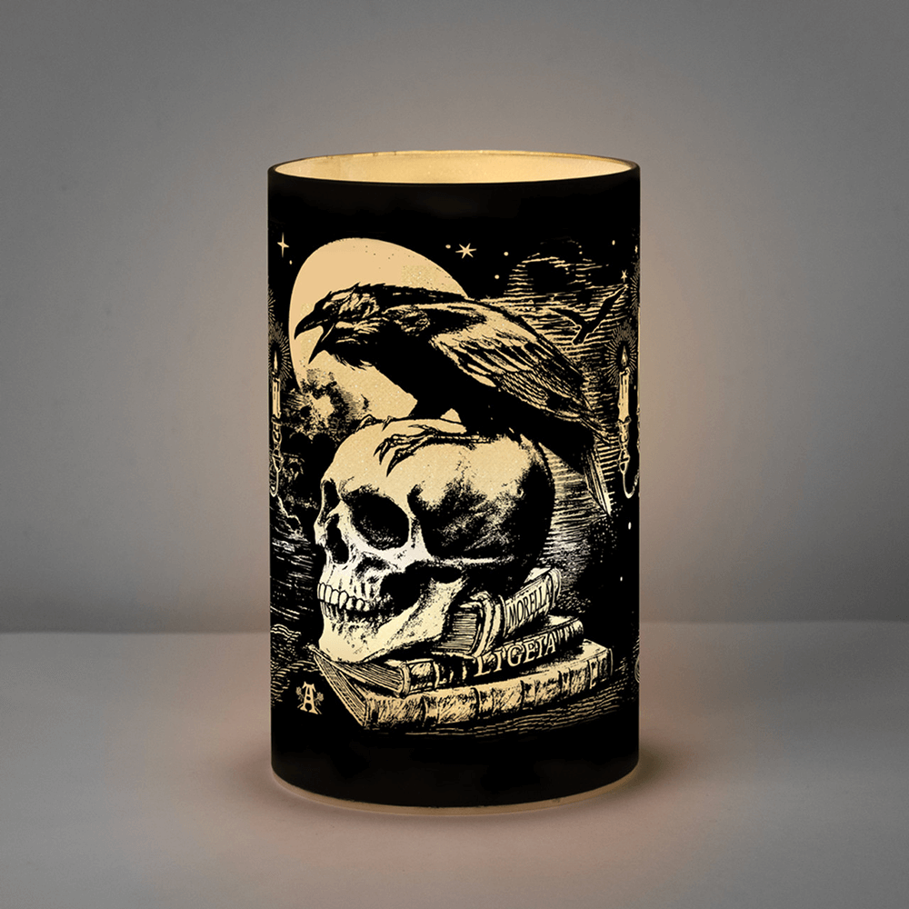 Gothic Raven and Skull LED candle lantern with etched glass and eerie glow, inspired by Edgar Allan Poe's haunting imagery.