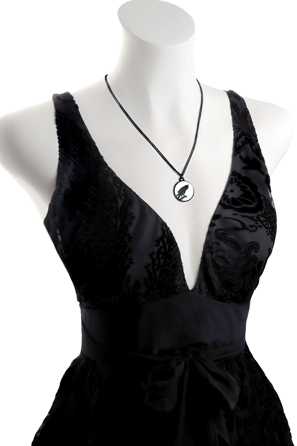 Gothic Raven Pendant with Moon Glow Medallion showcased on a black dress, highlighting its elegant gothic style.