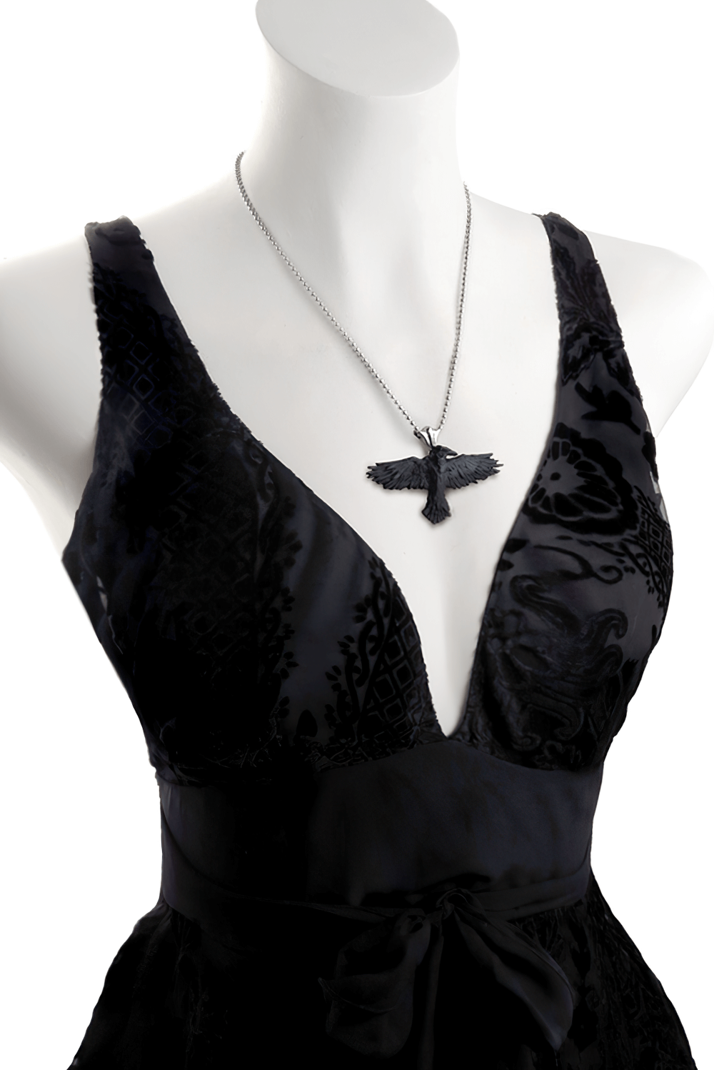 Gothic raven pendant on a stylish black dress, perfect for dark fantasy and alternative fashion lovers.