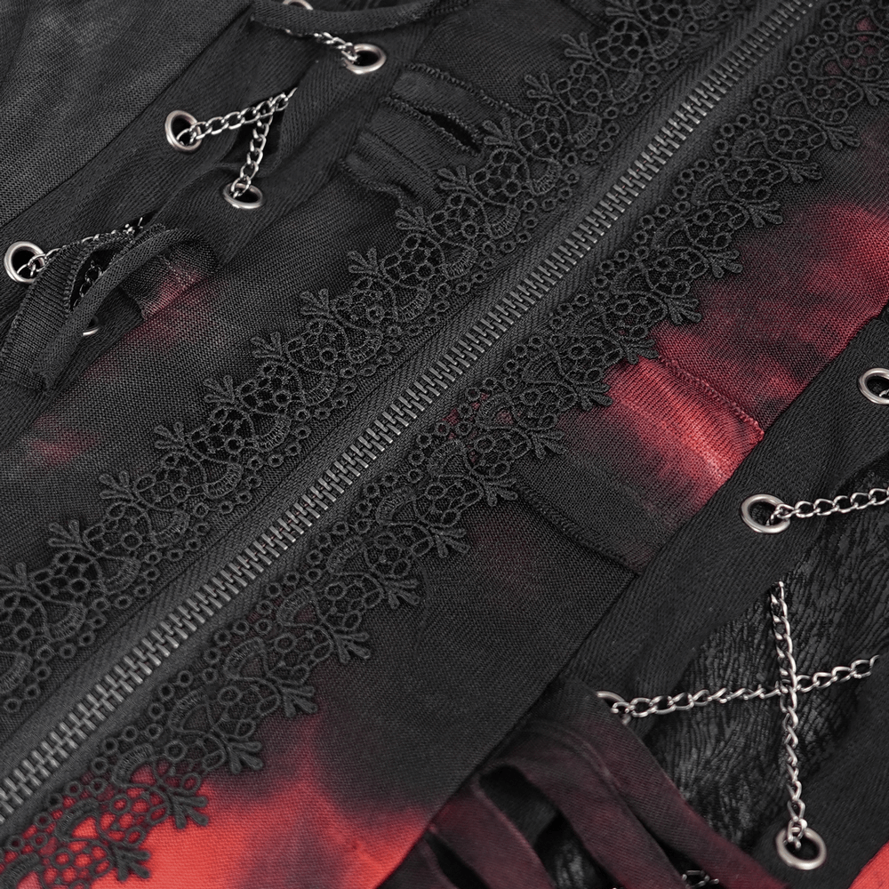 Close-up of Gothic red and black cape detailing, featuring lace and chain accents for a dramatic, edgy style.