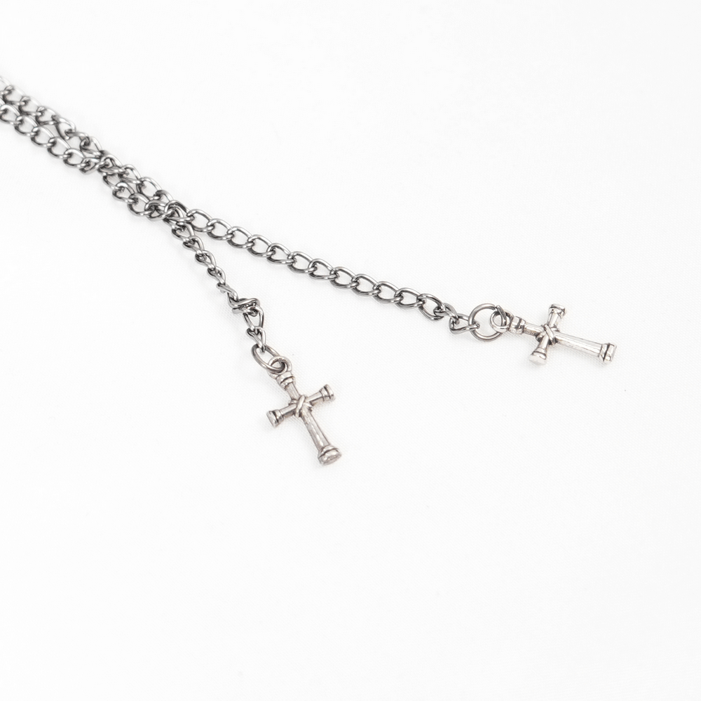 Gothic silver chain necklace with two small crosses, perfect for a dark alternative fashion statement.