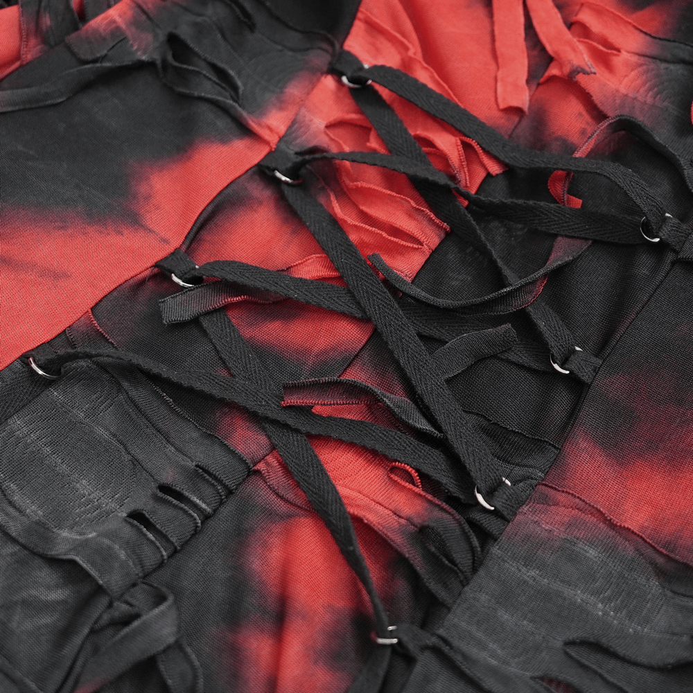 Close-up of the intricate lace-up details on a Gothic red and black shredded hooded cape. Perfect for dark fashion lovers.