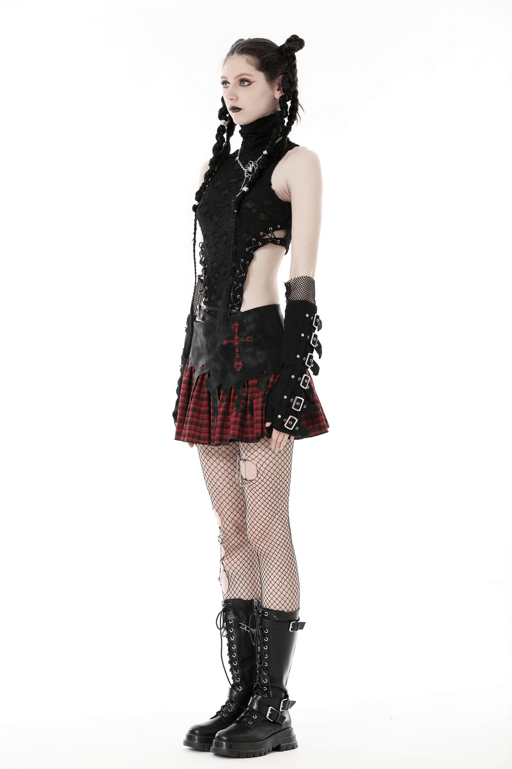 Gothic red and black plaid skirt with cross detail, paired with edgy punk rock outfit and combat boots.