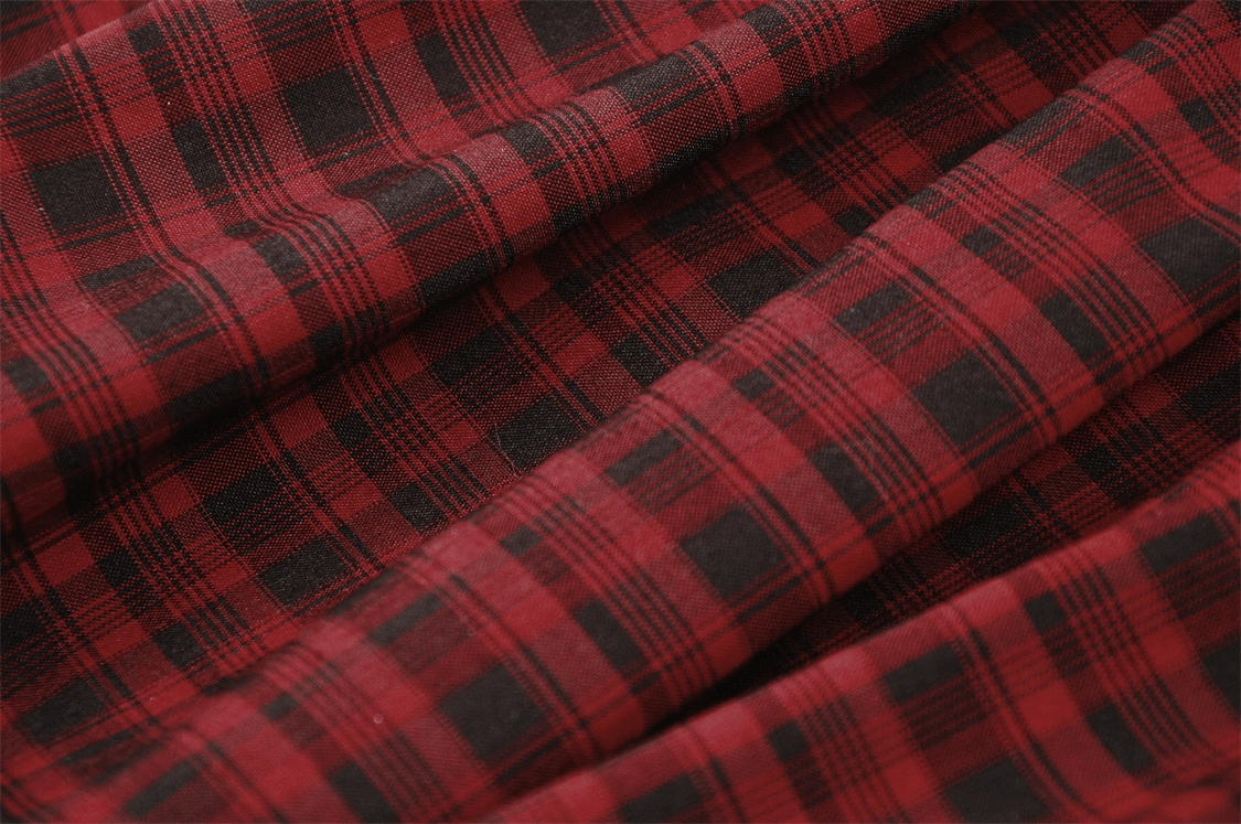 Close-up of red and black plaid fabric, perfect for a gothic punk rock skirt.