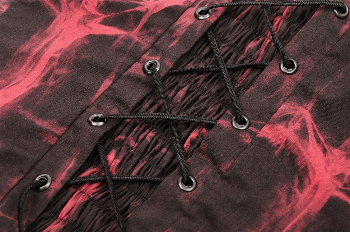 Close-up of black and red frill corset with intricate lacing and elegant ruching for an edgy look.