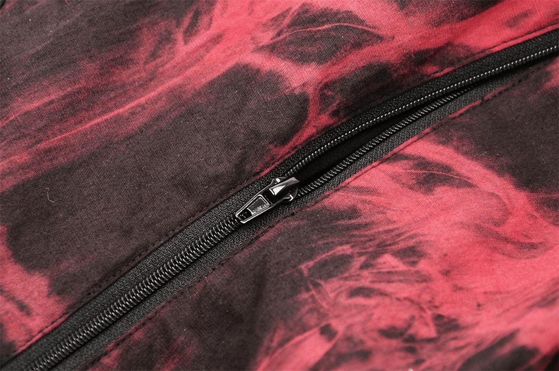 Close-up of a red and black corset zipper showcasing edgy design and fabric texture for gothic fashion.