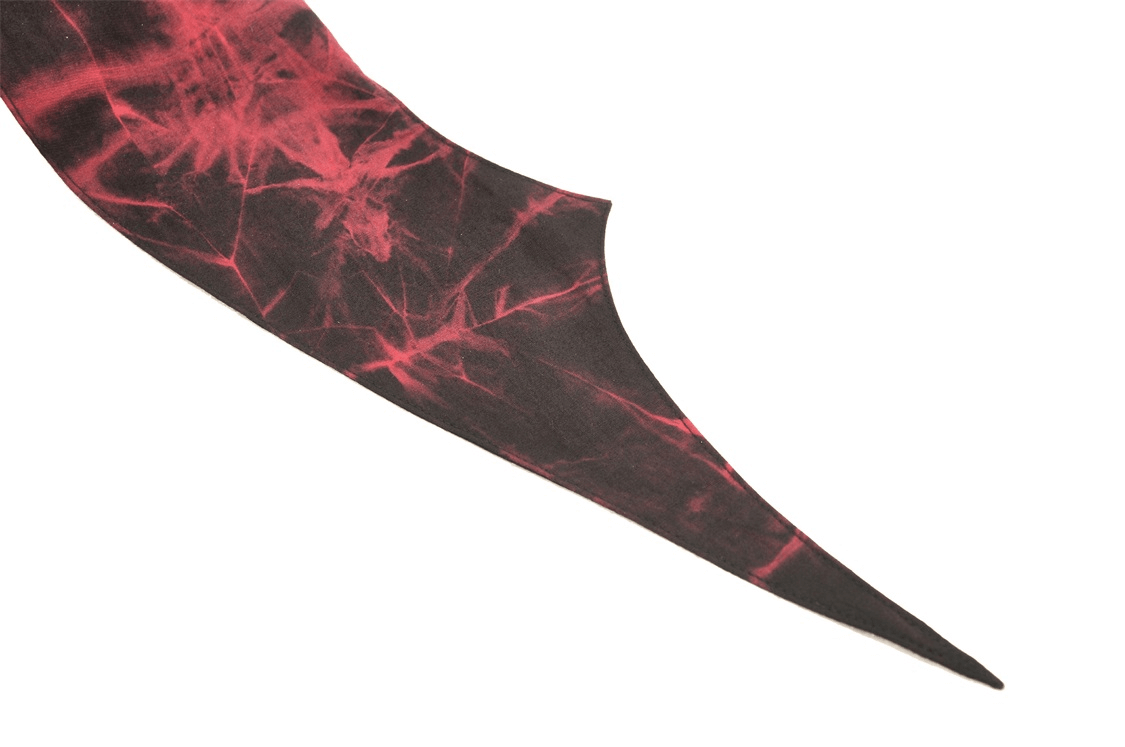 Gothic red and black fabric detail with dramatic pointed edge for edgy fashion.
