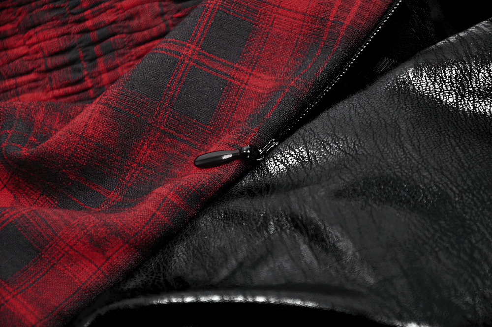 Close-up of Gothic red plaid and black leather dress, showcasing intricate lace-up details and stylish zip.