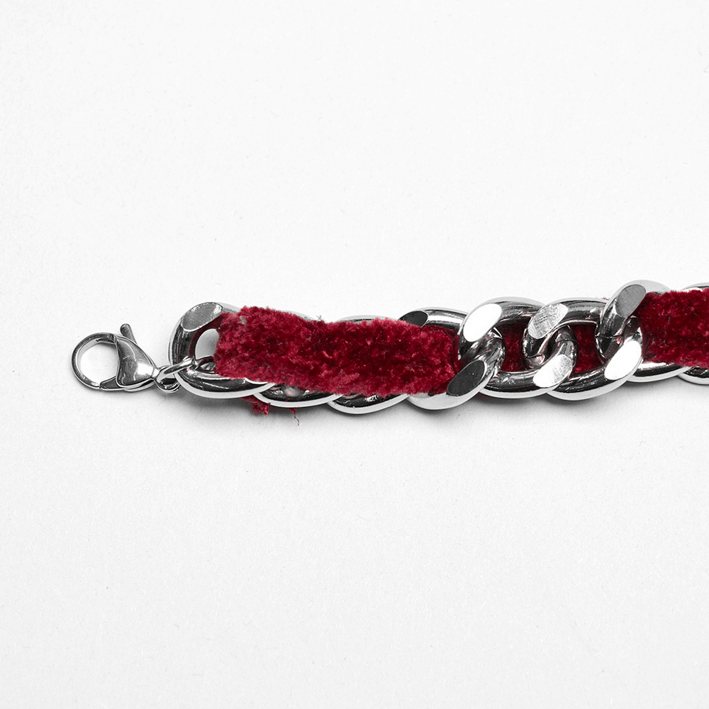 Close-up of Gothic red velvet choker necklace with alloy chain links and clasp detail, showcasing elegant design.