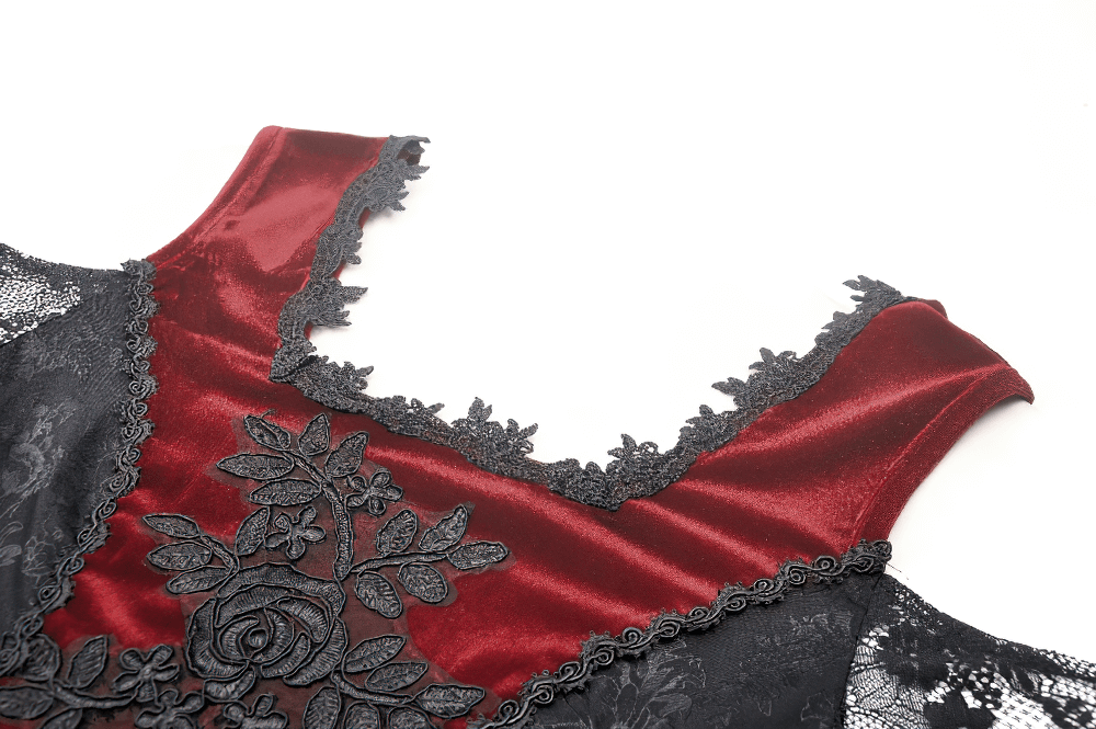 Close-up of Gothic red velvet off-shoulder top with black lace detailing and floral embroidery.