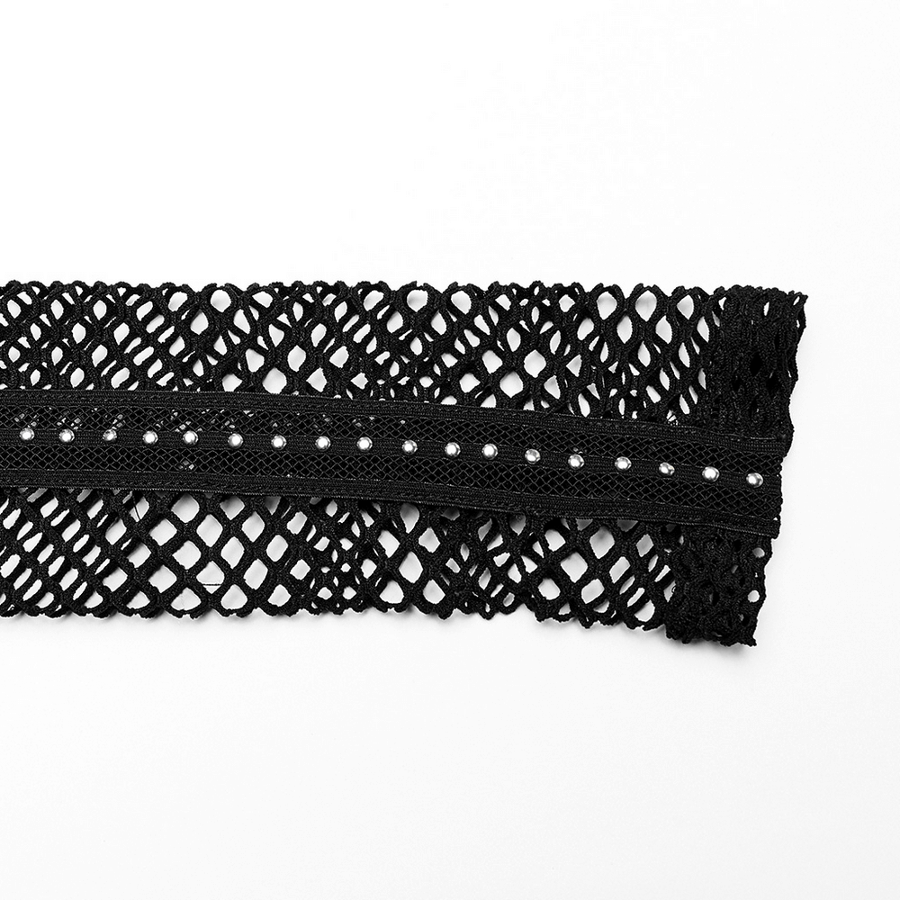 Close-up of black gothic mesh fabric with diamond pattern and studded design for edgy fashion styles.
