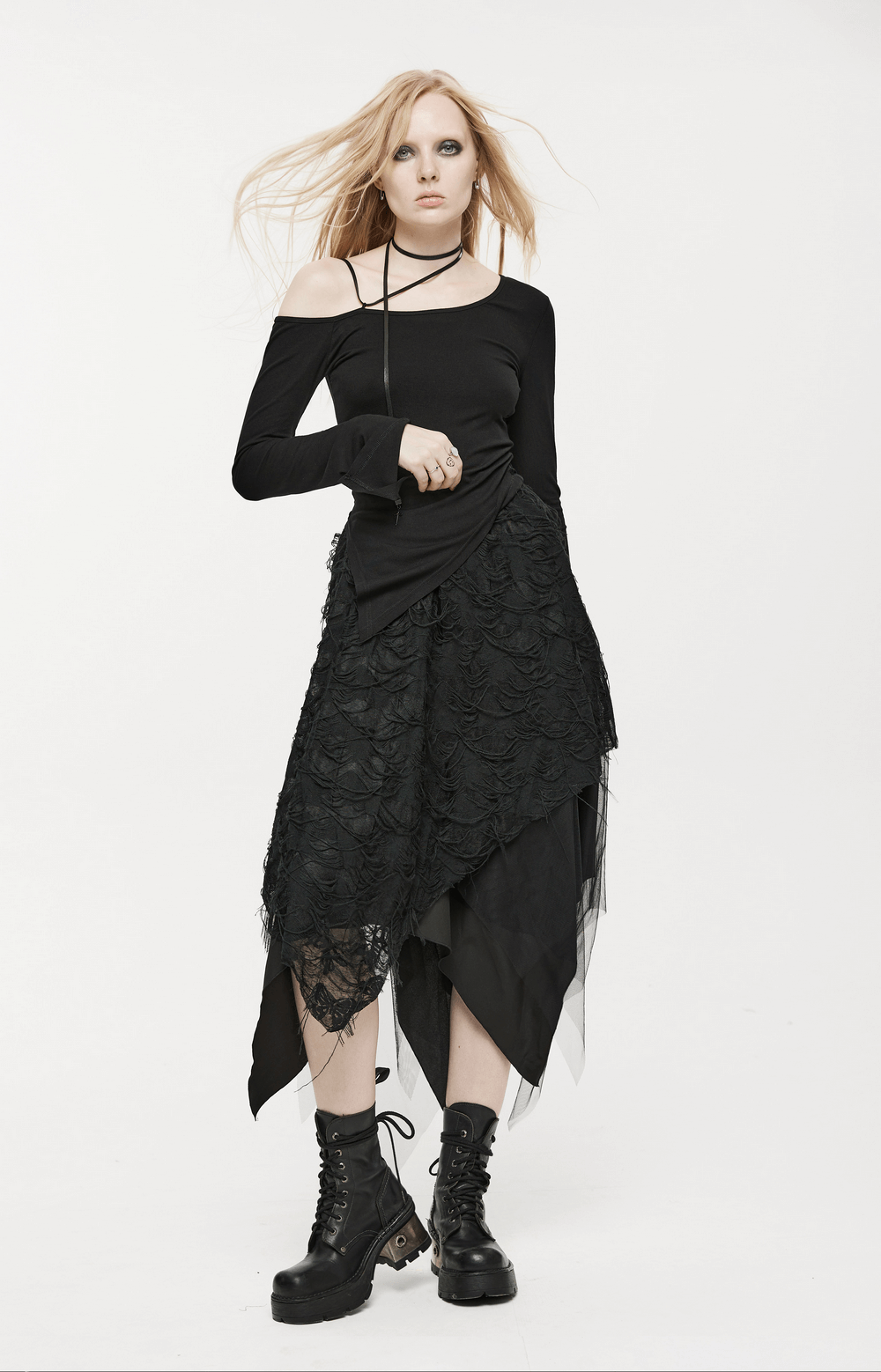 Gothic ripped butterfly asymmetrical mesh skirt, layered with tattered fabric, model exuding punk fairy vibes.