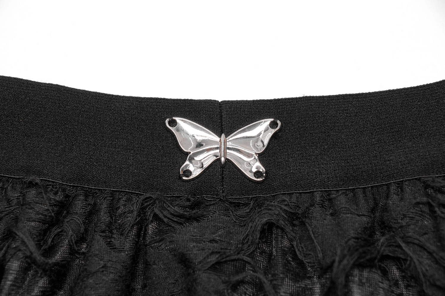 Close-up of the butterfly-shaped metal button on the Gothic Ripped Butterfly Skirt's waistband, showcasing intricate details.