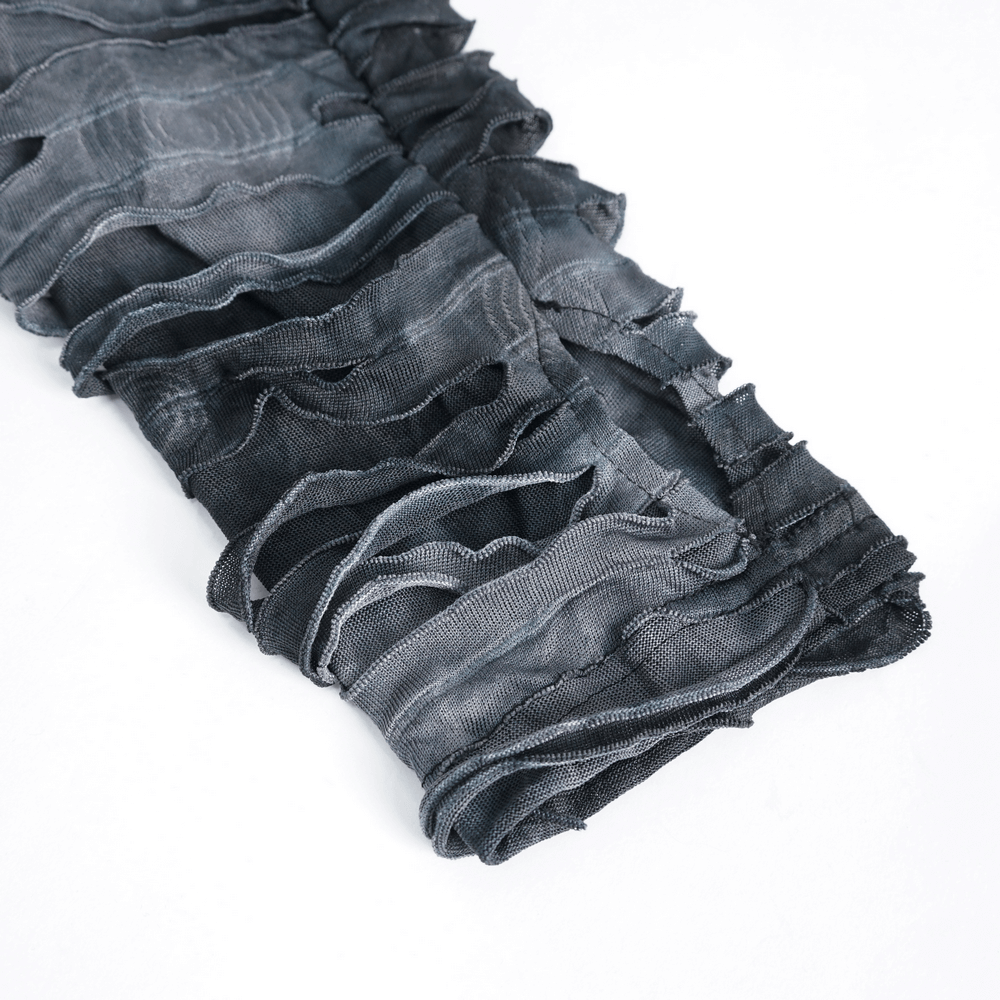 Close-up of gothic ripped hoodie fabric showcasing layered design and unique ruffles in dark gray.