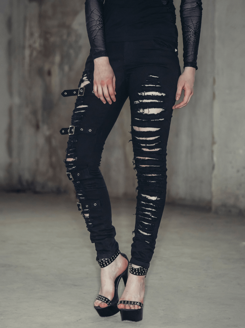 Gothic ripped black pants with buckles, showcasing a stylish steampunk look for women.