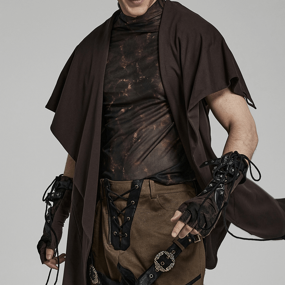 Man showcasing gothic rivet fingerless gloves with edgy punk style and stylish dark outfit.