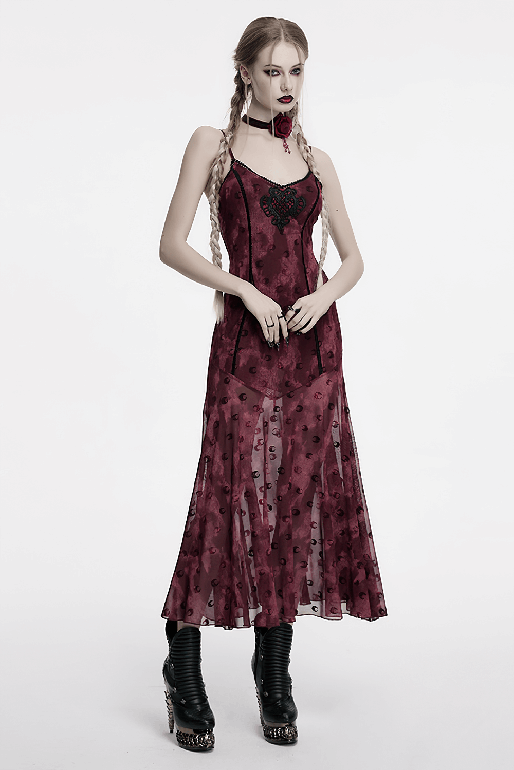 Gothic model wearing a burgundy floral dress with a lace detail, paired with a rose choker and edgy black boots.