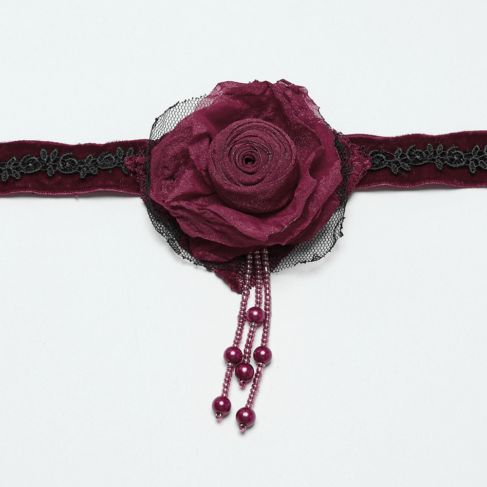 Gothic rose choker with lace, bead chains, and vintage details, symbolizing warmth and power.
