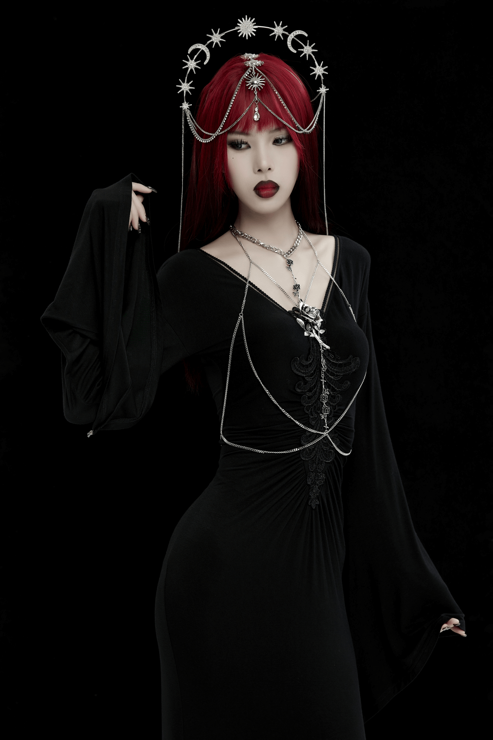 Elegant gothic woman wearing a rose chain body accessory with a 3D rose charm, thorns, and intricate side-hanging chains.