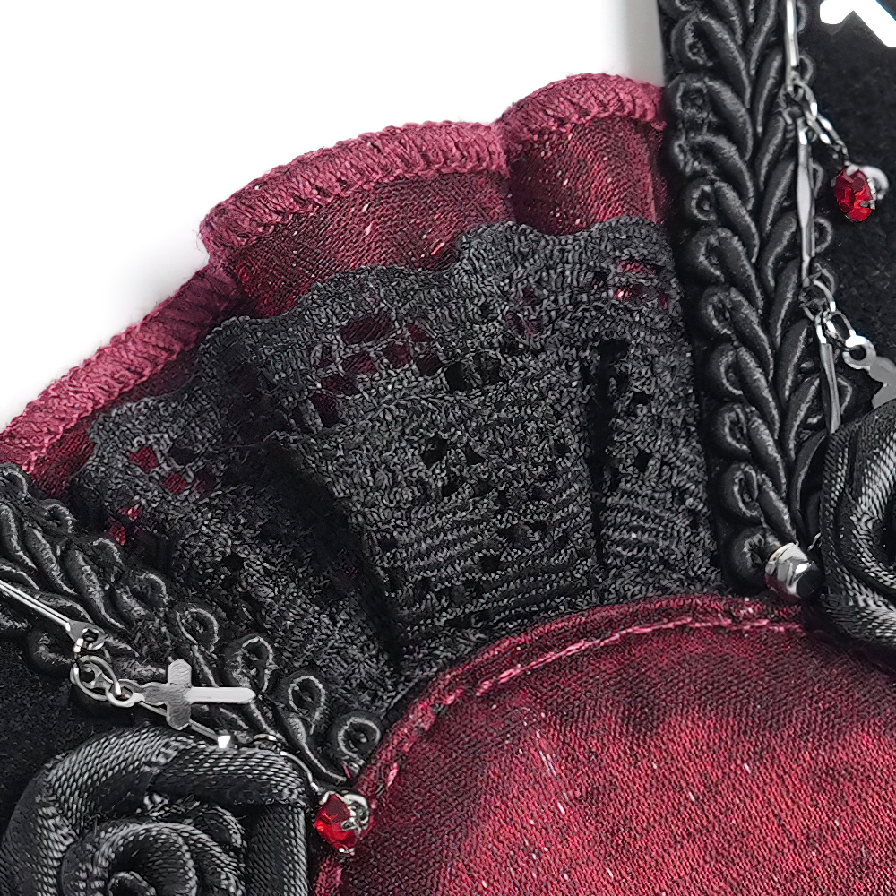 Close-up of black lace and dark red rose detailing on a gothic hair clip.