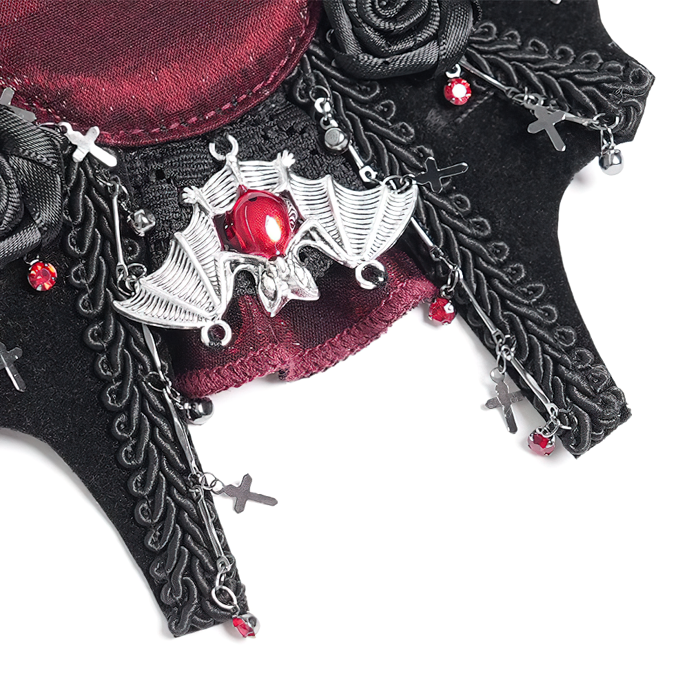 Gothic rose cross hair clip featuring a bat charm, spider web design, and red embellishments for dark style.
