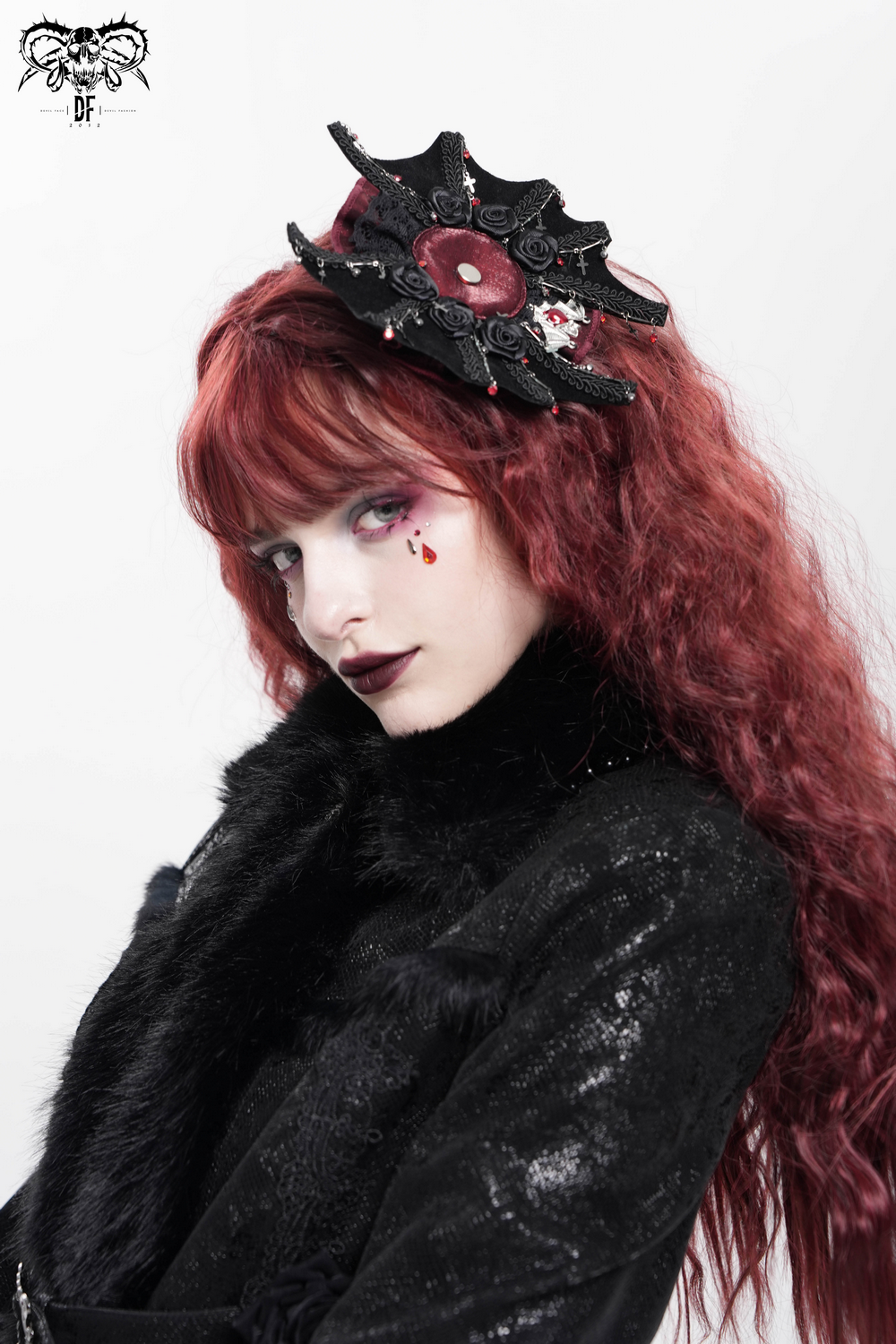 Gothic rose cross hair clip with spider web and skull detail, perfect for a dark romantic look.