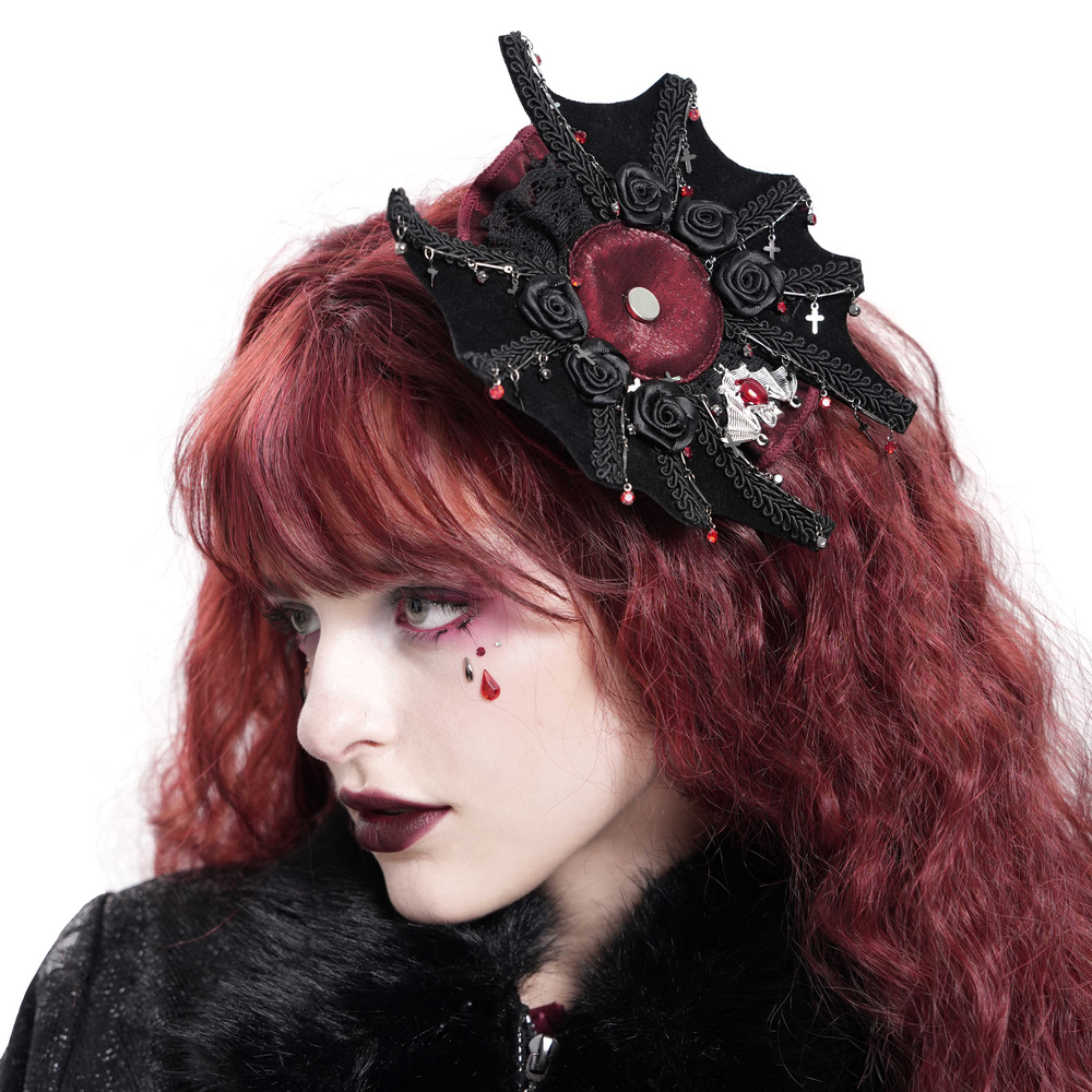 Gothic rose cross hair clip with spider web design and skull detail worn by model with red hair.