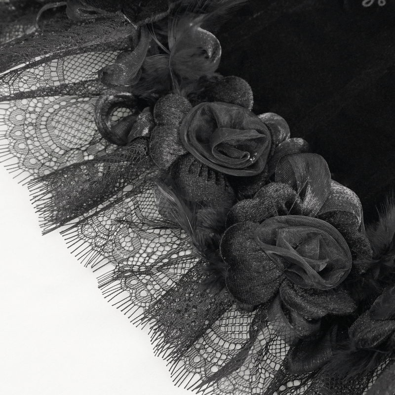 Close-up of black lace trim and gothic rose detailing on feather neckwear collar for women.