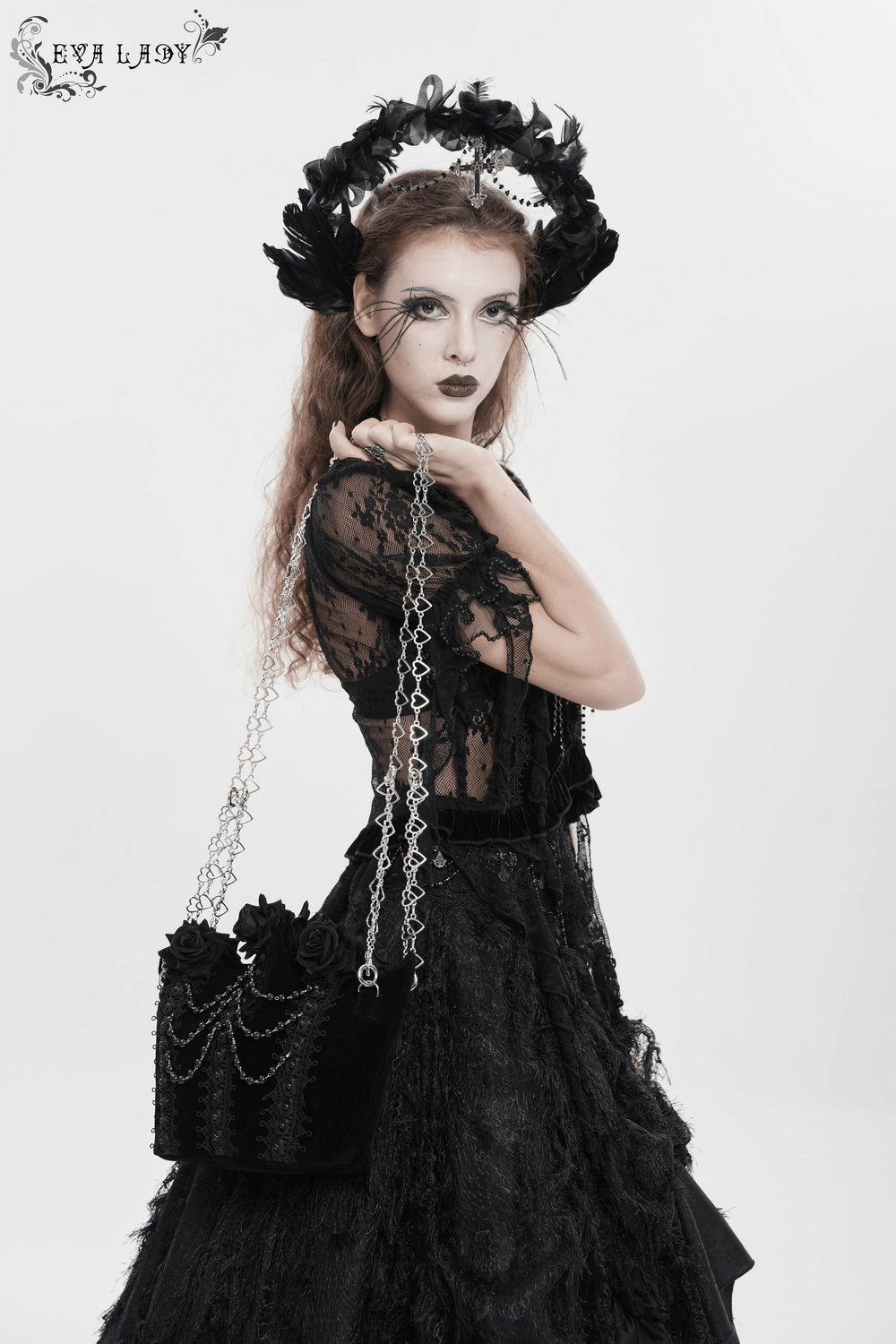 Gothic Rose Velvet Handbag with Pearl Chains and Lace on model in black lace dress, silver heart chain strap, dark romantic style