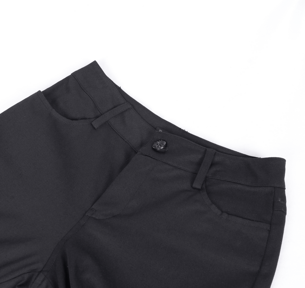 Close-up of stylish black pants with a button and pocket details, perfect for alternative fashion.