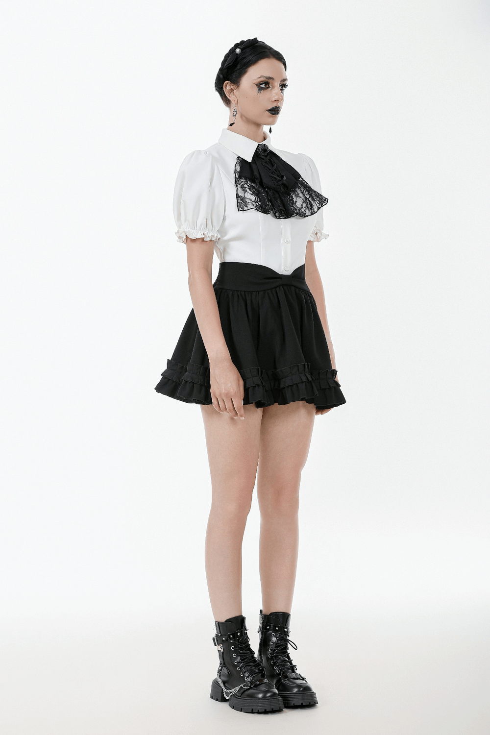 Gothic ruffle mini skirt with bow, paired with a stylish puff-sleeve blouse and combat boots for a chic ensemble.