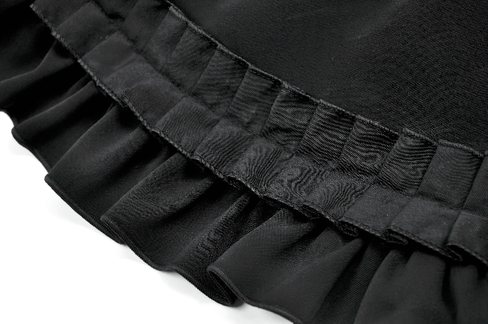 Close-up of elegant black satin ruffle hem, showcasing intricate detailing and texture for Gothic or Lolita outfits.