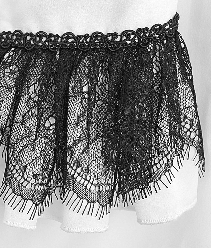 Close-up of gothic black lace trim on a white high collar shirt, showcasing intricate details and vintage charm.