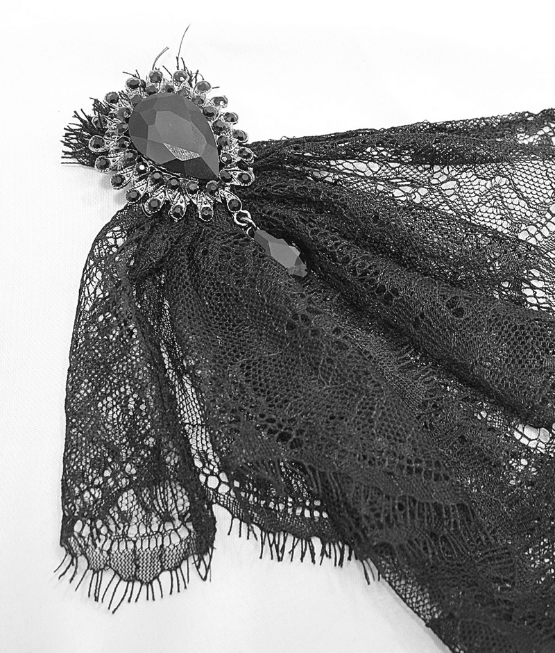 Elegant black lace bowtie detail with jewel embellishment, perfect for gothic style fashion.