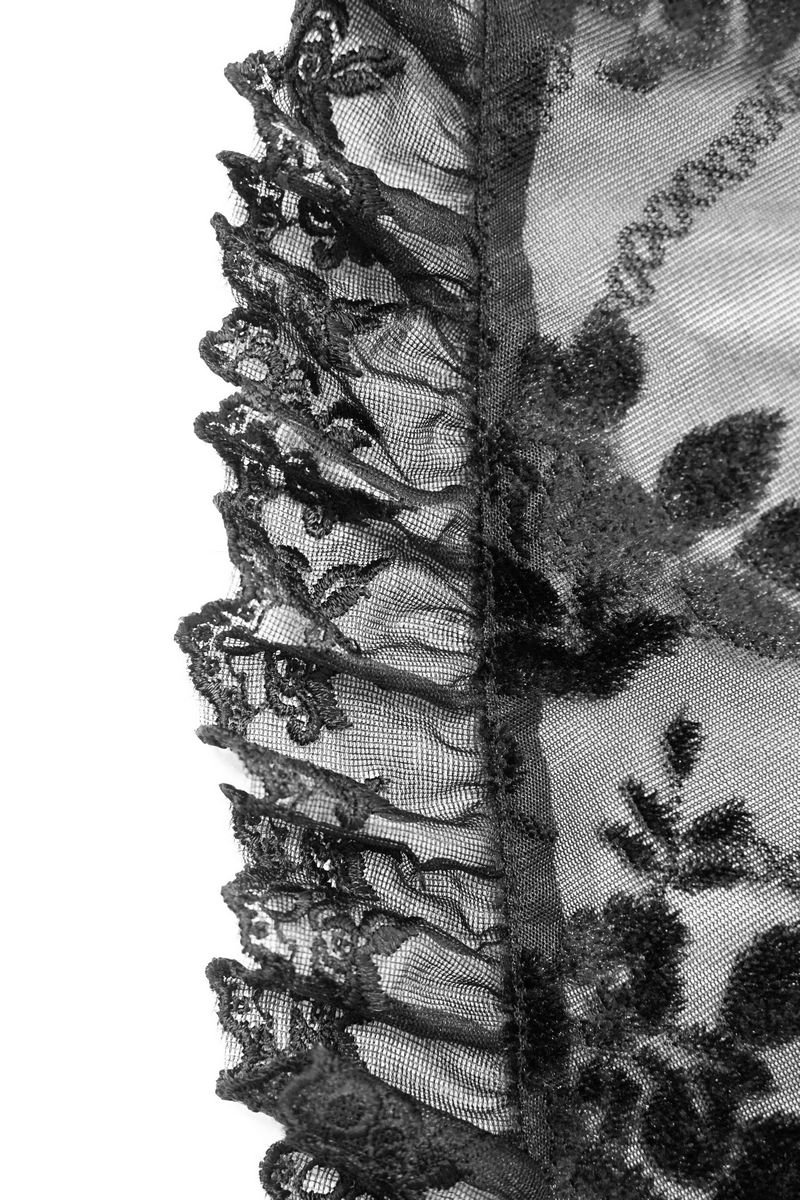 Close-up of ruffled black lace fabric showcasing floral patterns for gothic ladies' bolero.