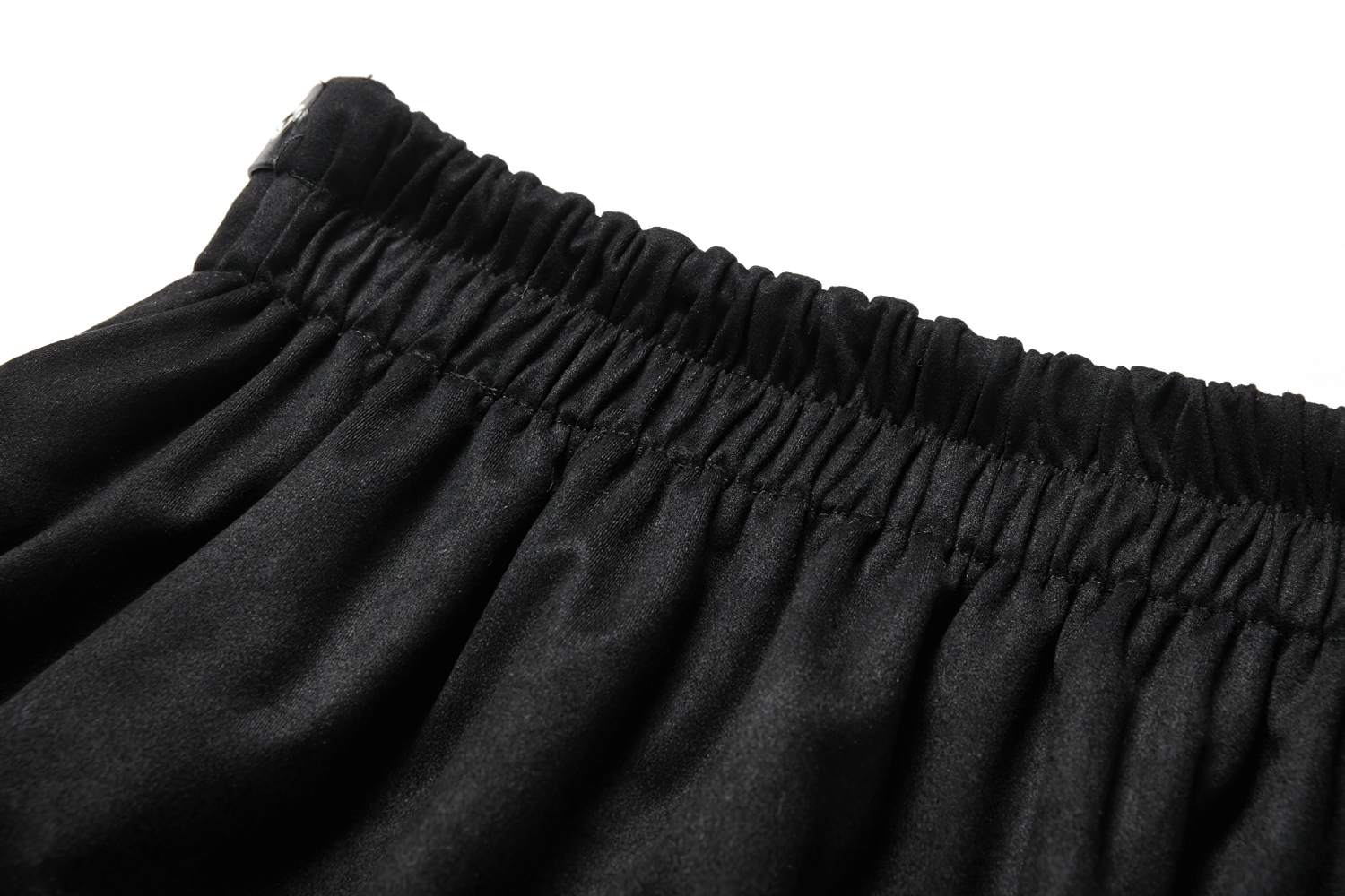 Close-up of the waistband of a black gothic ruffled skirt featuring elastic fabric for a comfortable fit.