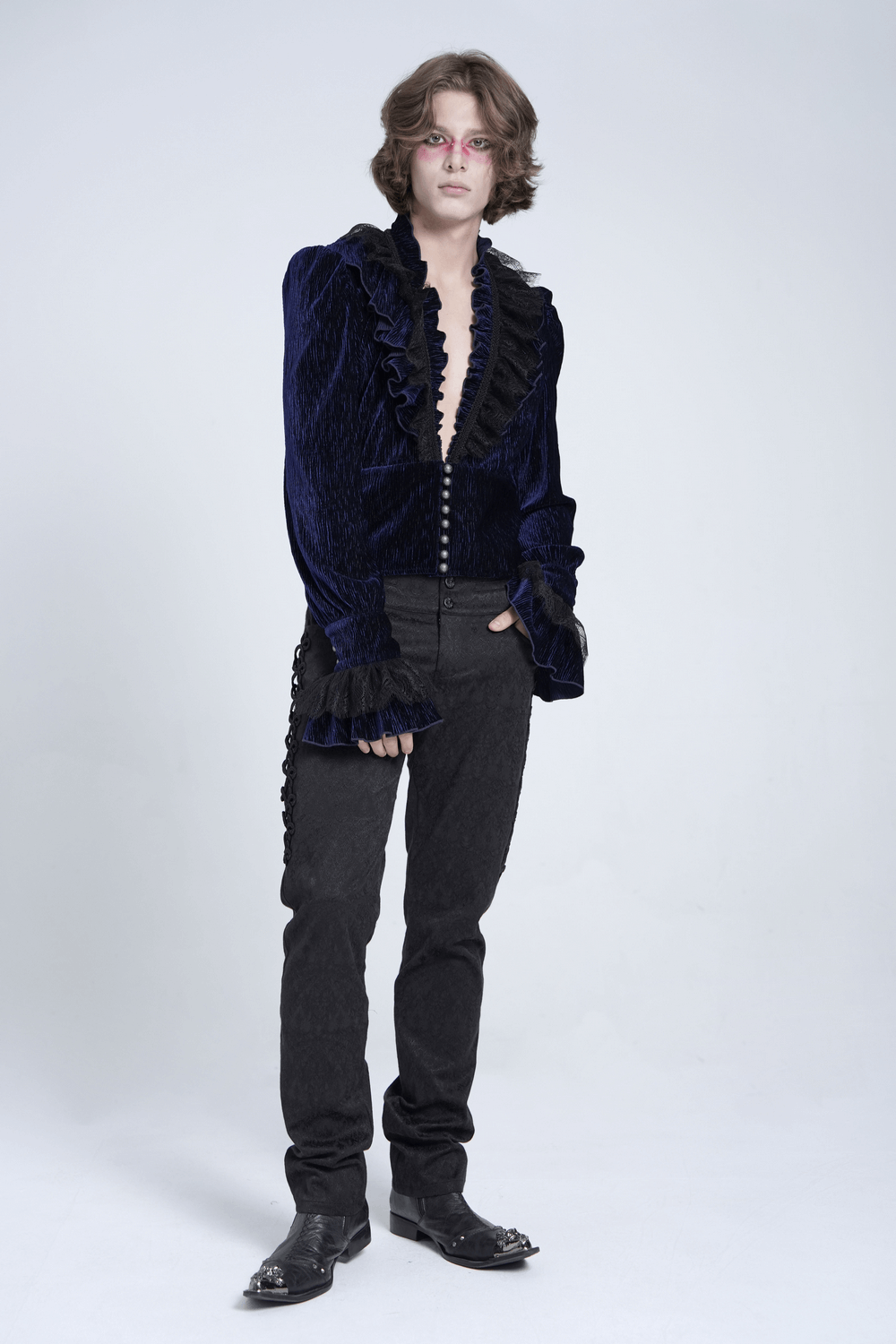 Gothic ruffled velvet shirt with lace and pearls, styled with black pants and boots, perfect for a dramatic look.