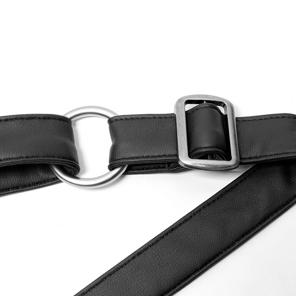Stylish black faux leather belt with silver buckle and circular ring detail, perfect for adding flair to any outfit.