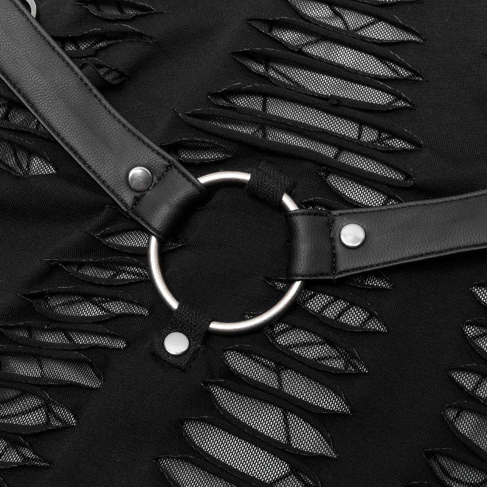 Close-up of gothic mini dress detailing with spider web cutouts and stylish ring accent.