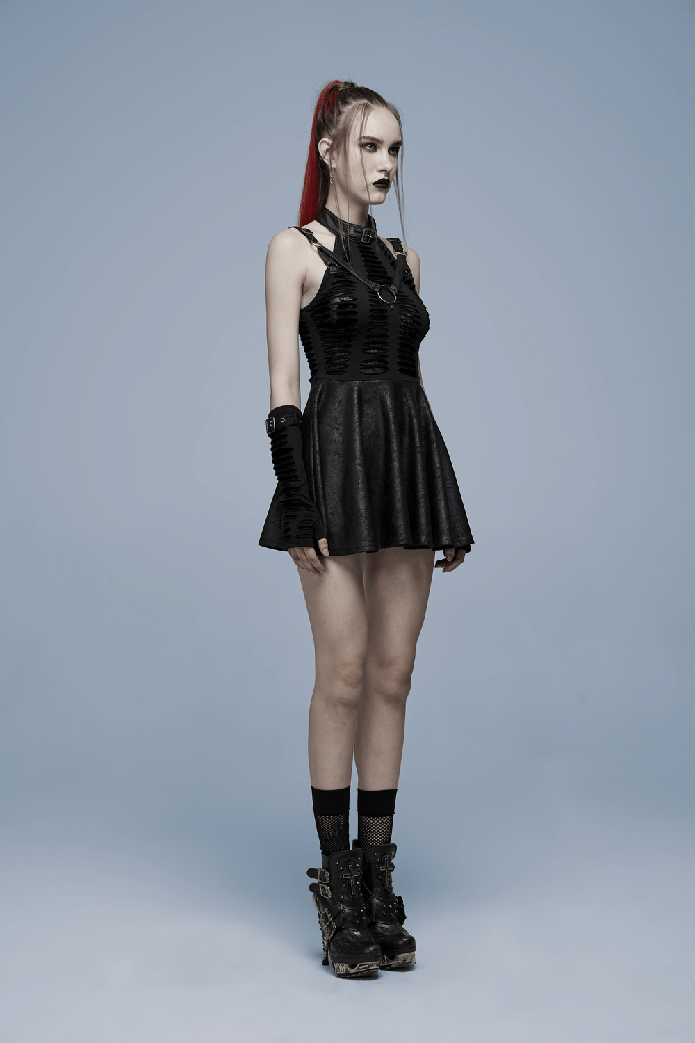 Gothic sexy cut mini dress with spider web detail, showcasing daring cutouts and playful swing skirt.