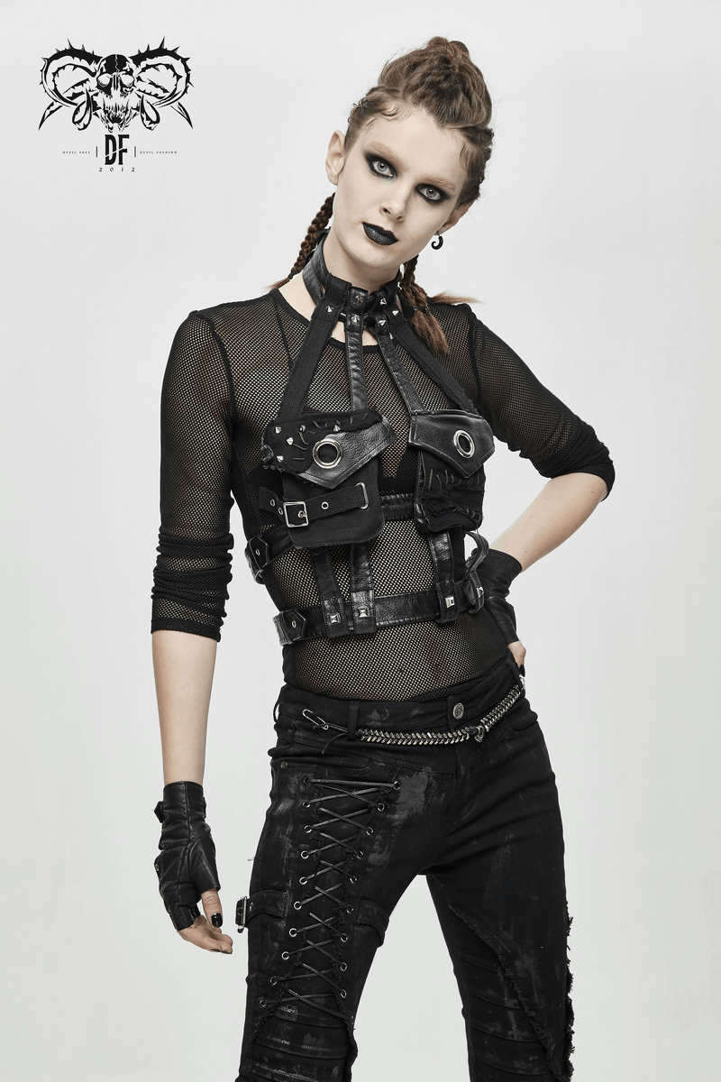 Gothic sexy woman in a PU leather body bondage harness with black mesh shirt and stylish gloves.