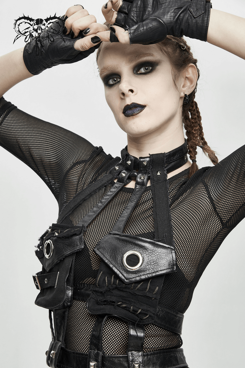 Gothic sexy woman in PU leather bondage harness with pockets, fishnet top, and dramatic makeup for a bold statement.