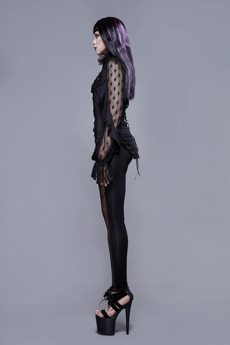Elegant gothic woman in black lace beading blouse and leggings, showcasing a stylish lace-up back design.