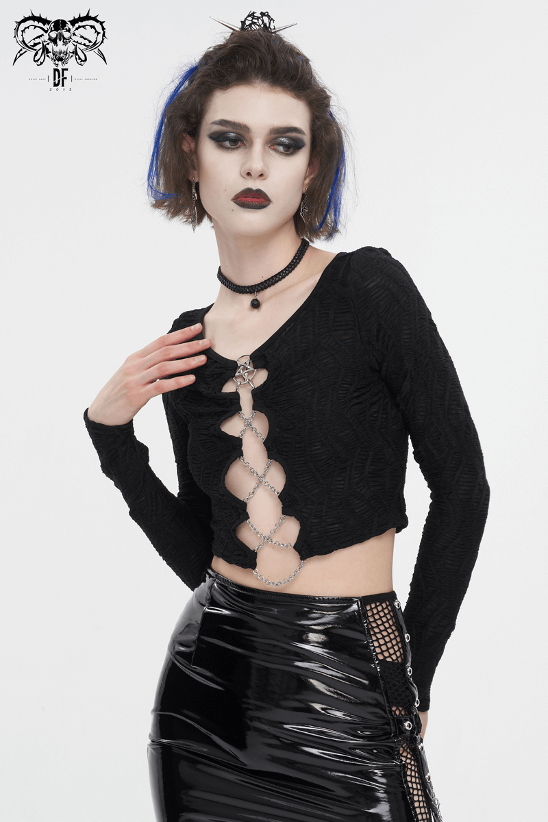 Gothic long sleeve black crop top with chain lace-up details, paired with a glossy skirt, perfect for edgy fashionistas.