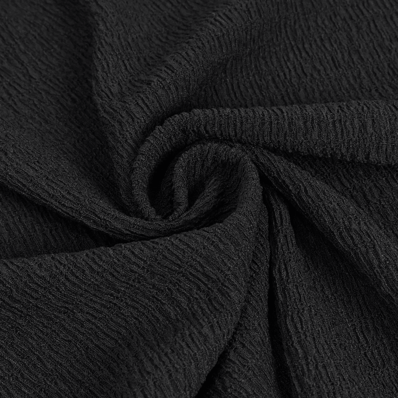 Textured black fabric close-up, perfect for stylish gothic flared trousers and adding elegance to your wardrobe.