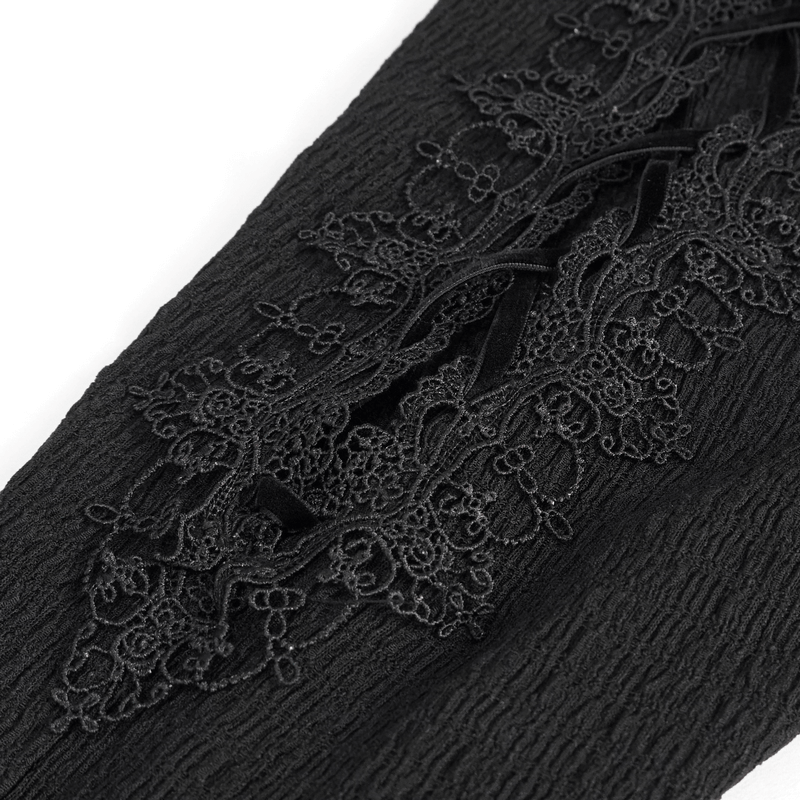Close-up of lace appliqué detail on Gothic sexy slim lace-up flared trousers in black fabric.